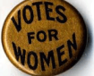 a badge or button displaying the words VOTES FOR WOMEN