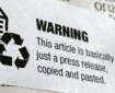 image of a sticker over newsprint: sticker reads "WARNING This article is basically just a press release, copied and pasted."