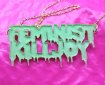 Picture of a pendant enamelled with the words "Feminist KillJoy" in a Tales from the Crypt comic style