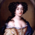 Portrait of C17th pale, brunette woman in off-shoulder gown.
