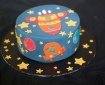 Cake decorated with a rocket ship and aliens