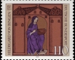 Postage stamp showing medieval woodcut of nun in blue robe.