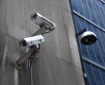 Surveillance cameras attached to a building exterior