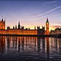 Photograph of Westminster Palace, home of the UK Parliament, taken at dusk from across the river Thames.