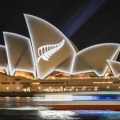 A silver fern projected onto sail structure of Sydney Opera House